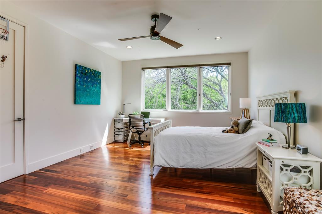 48 Ash Bluff Lane Dallas, TX 75248 - Photo 19 of 40 a bedroom with furniture and a window