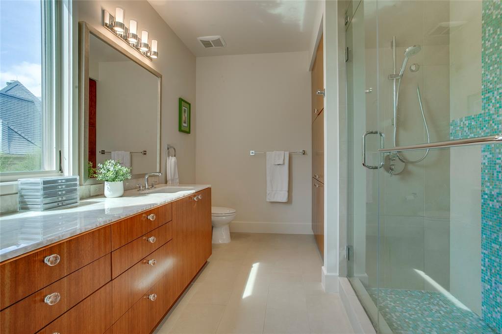 48 Ash Bluff Lane Dallas, TX 75248 - Photo 20 of 40 a bathroom with a double vanity sink a large mirror and shower