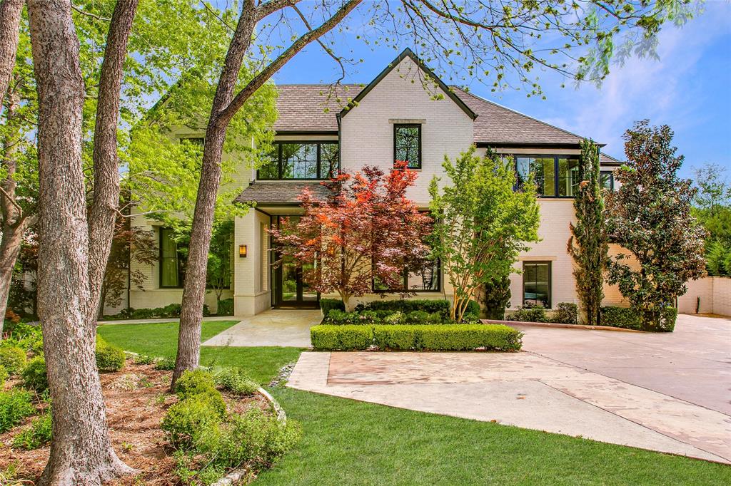 48 Ash Bluff Lane Dallas, TX 75248 - Photo 2 of 40 a front view of a house with a yard and trees