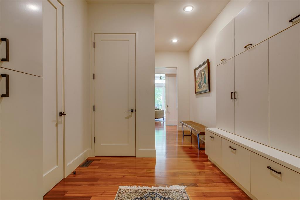 48 Ash Bluff Lane Dallas, TX 75248 - Photo 23 of 40 a view of a hallway with wooden floor and staircase