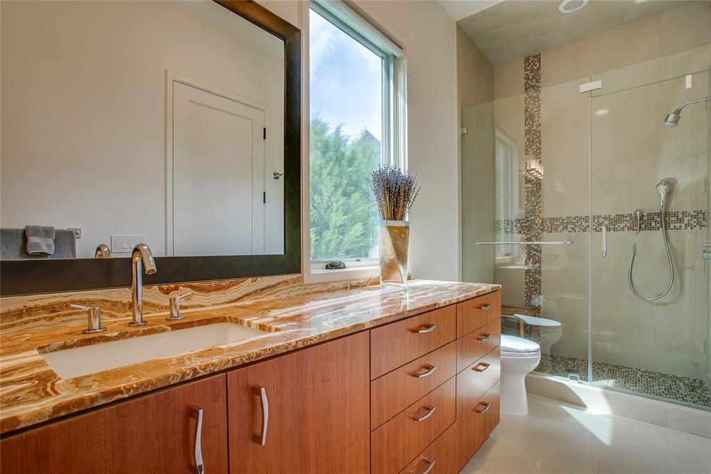 48 Ash Bluff Lane Dallas, TX 75248 - Photo 25 of 40 a bathroom with a granite countertop sink toilet and shower