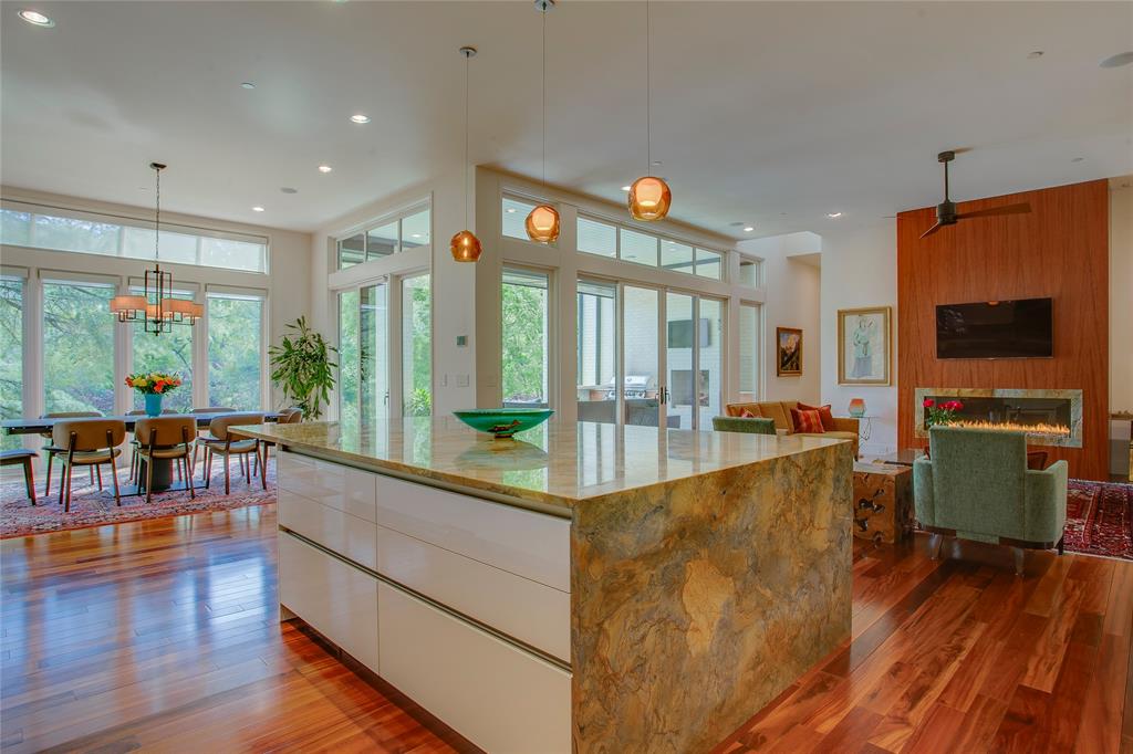 48 Ash Bluff Lane Dallas, TX 75248 - Photo 28 of 40 a living room with furniture a flat screen tv and a large window