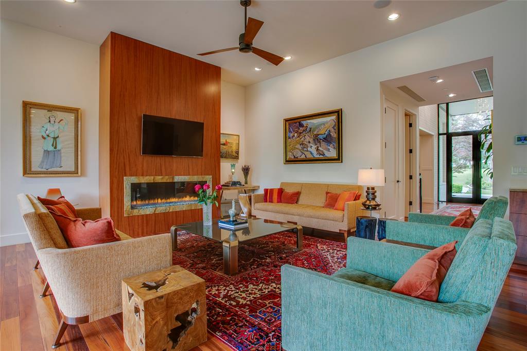 48 Ash Bluff Lane Dallas, TX 75248 - Photo 3 of 40 a living room with furniture and a flat screen tv