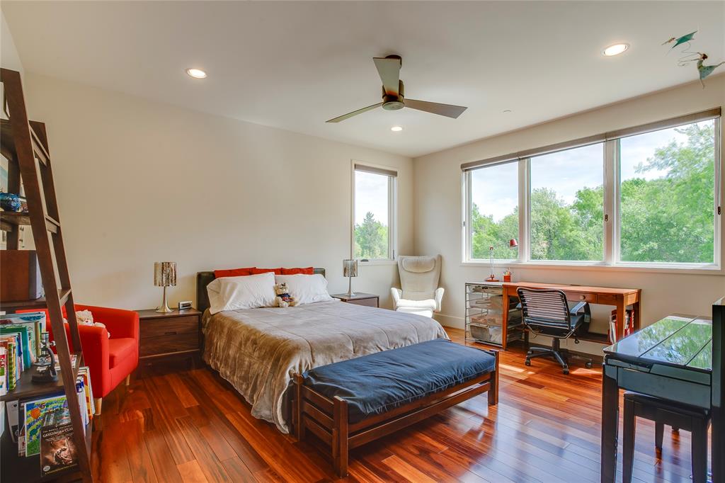 48 Ash Bluff Lane Dallas, TX 75248 - Photo 32 of 40 a bedroom with a bed and wooden floor