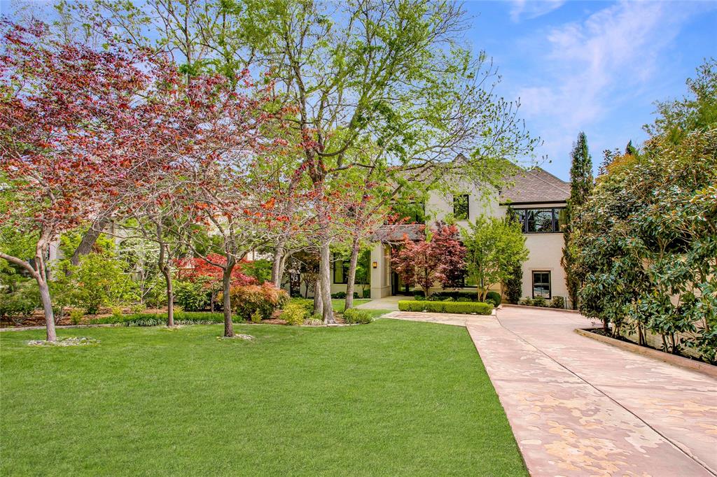 48 Ash Bluff Lane Dallas, TX 75248 - Photo 35 of 40 a front view of a house with a yard and trees