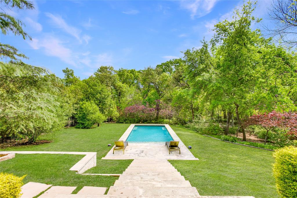 48 Ash Bluff Lane Dallas, TX 75248 - Photo 36 of 40 a view of yard with swimming pool and green space