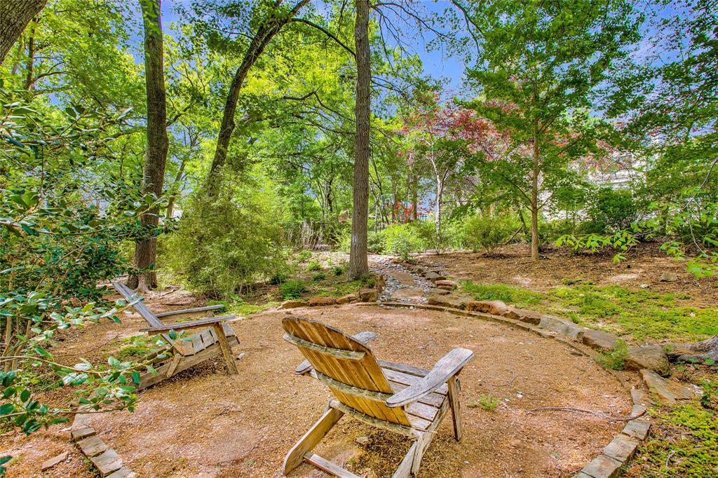 48 Ash Bluff Lane Dallas, TX 75248 - Photo 39 of 40 a view of a backyard with chairs