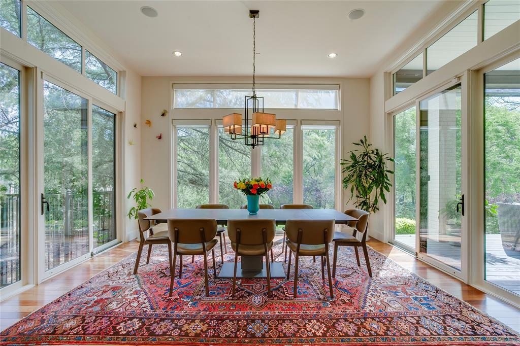 48 Ash Bluff Lane Dallas, TX 75248 - Photo 5 of 40 a dining room with furniture a chandelier and wooden floor