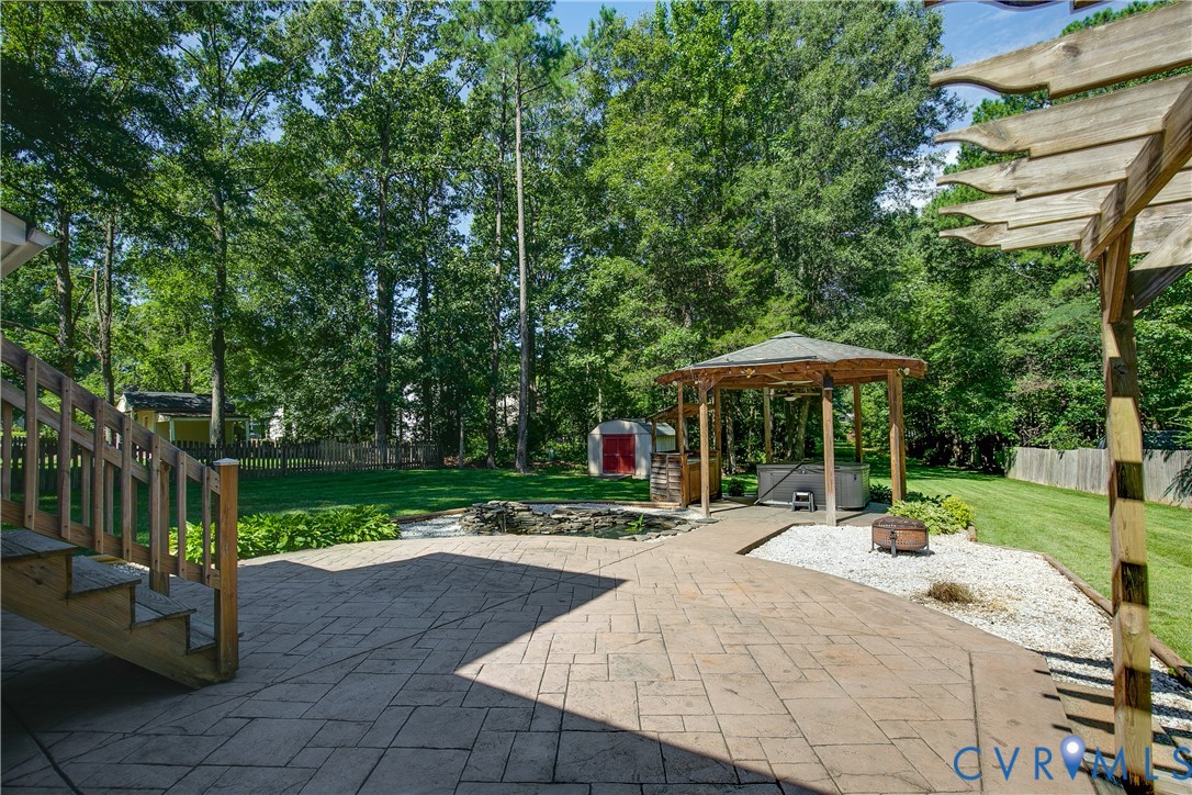 3114 Shiloh Church Road Midlothian, VA 23112 - Photo 26 of 34 Expansive backyard featuring a stamped concrete pa