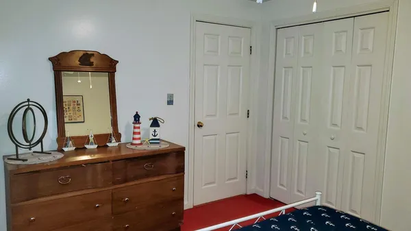 a room with a sink and a mirror