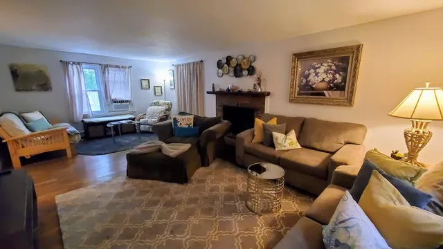 a living room with furniture or couch and a fireplace