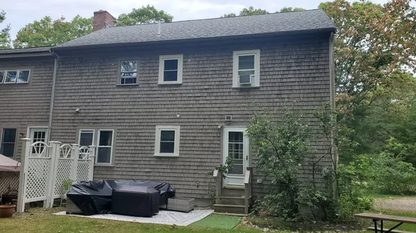 a brick house with a small yard