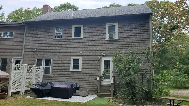 a brick house with a small yard