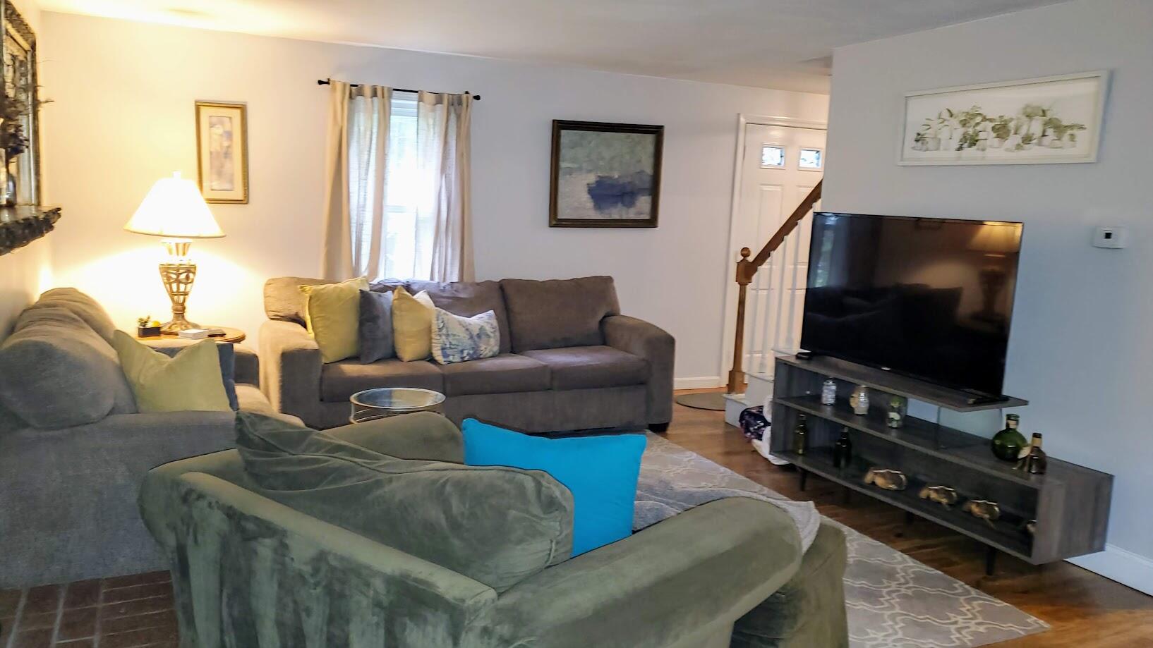 185 Monhegan Road East Falmouth, MA 02536 - Photo 5 of 23 a living room with furniture and a flat screen tv
