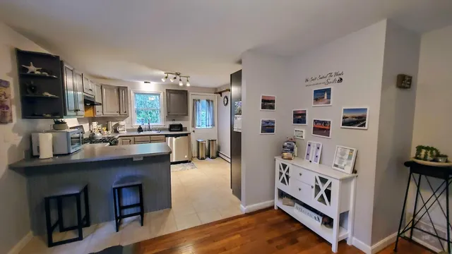 a kitchen with stainless steel appliances a sink and a refrigerator