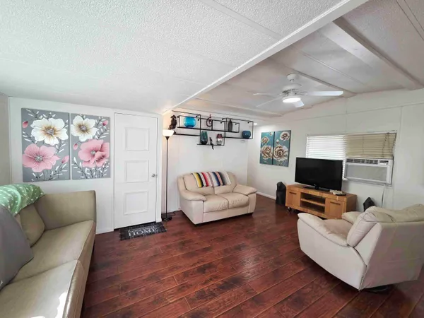 a workspace with furniture and wooden floor