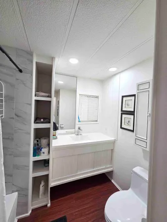a view of washer and dryer with wooden floor