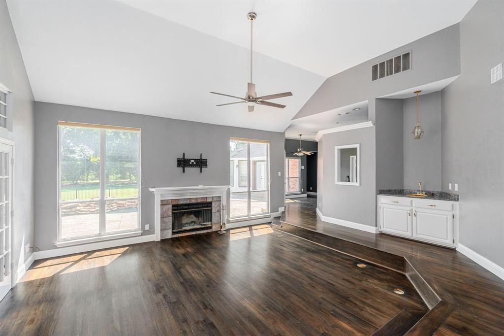 1380 Meandro Ria Lane Fairview, TX 75069 - Photo 4 of 14 a view of an empty room with a fireplace and a window