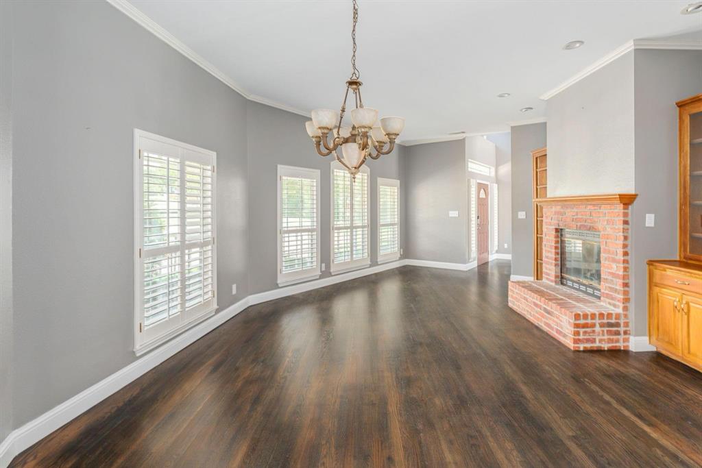 1380 Meandro Ria Lane Fairview, TX 75069 - Photo 5 of 14 a view of an empty room with wooden floor and a window