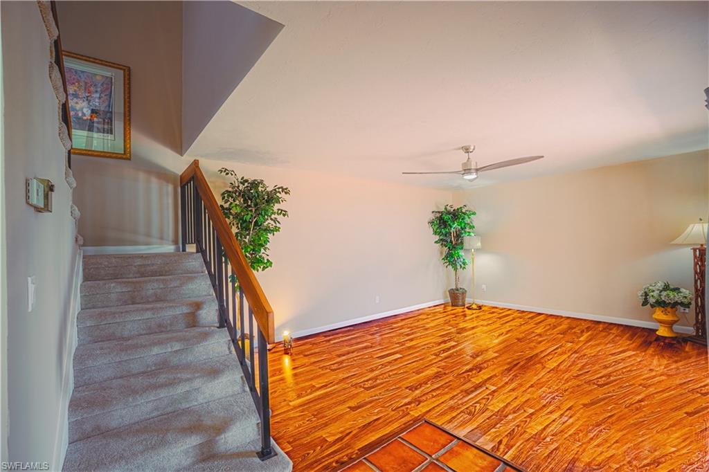 200 Marseille Drive, Unit 12A Naples, FL 34112 - Photo 15 of 36 a bedroom with a bed and a potted plant