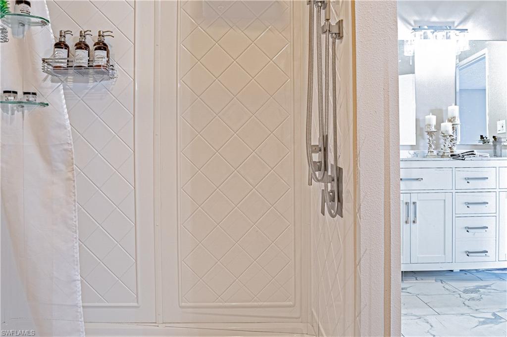 200 Marseille Drive, Unit 12A Naples, FL 34112 - Photo 22 of 36 a bathroom with a shower