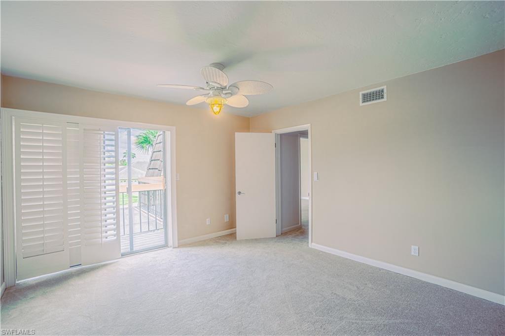 200 Marseille Drive, Unit 12A Naples, FL 34112 - Photo 26 of 36 an empty room with windows and closet