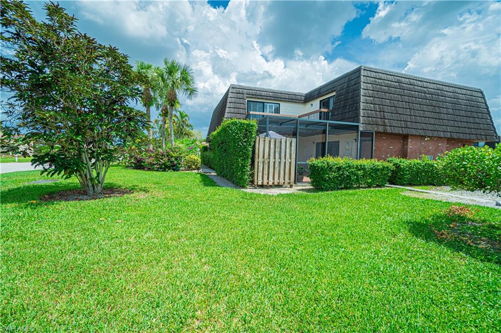 200 Marseille Drive, Unit 12A Naples, FL 34112 - Photo 36 of 36 a front view of a house with a garden