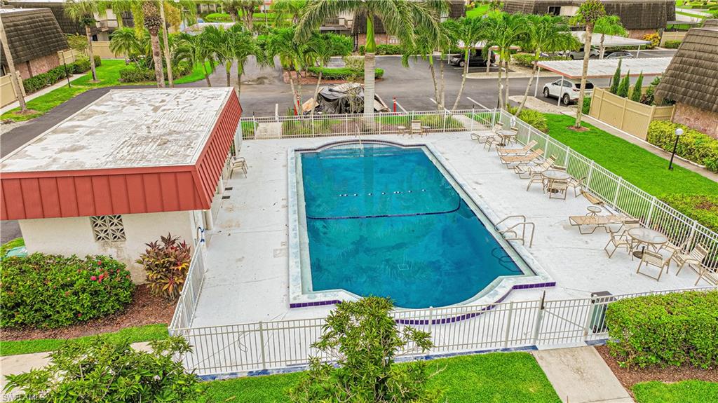 200 Marseille Drive, Unit 12A Naples, FL 34112 - Photo 6 of 36 a view of a swimming pool with a patio