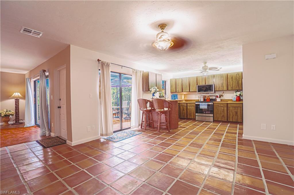 200 Marseille Drive, Unit 12A Naples, FL 34112 - Photo 8 of 36 a view of a livingroom with furniture and window