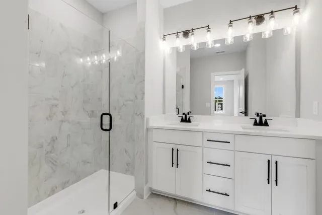 a bathroom with a shower and toilet