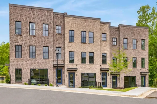 a large building with a street that has windows on it