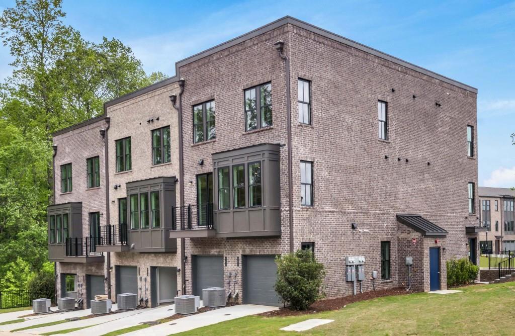 923 Echo Pk Drive Suwanee, GA 30024 - Photo 5 of 26 a front view of a house with a yard