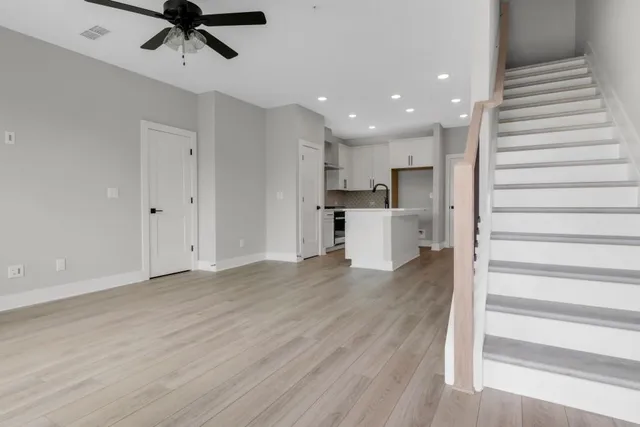 a view of kitchen with microwave and refrigerator