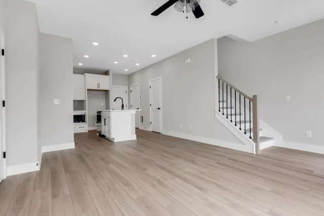 a kitchen with stainless steel appliances a sink stove and refrigerator