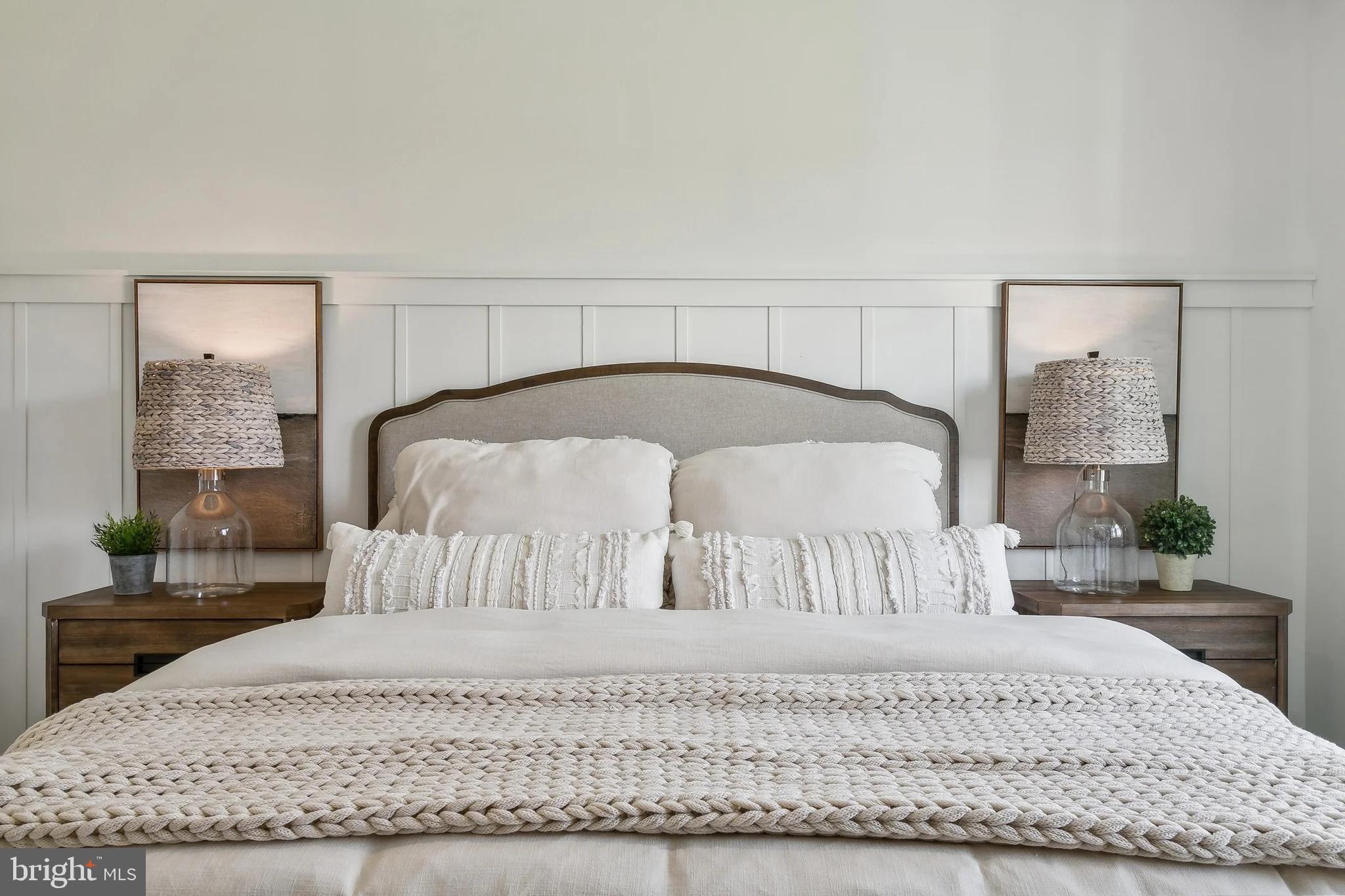 437 Gerry Street Ranson, WV 25438 - Photo 12 of 29 a bedroom with a bed and wooden floor