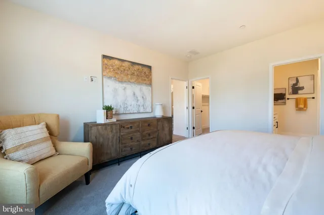 a bedroom with furniture and window