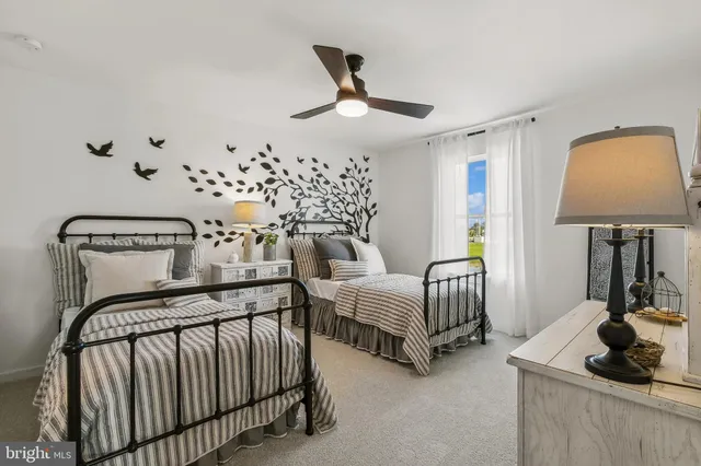 a bedroom with bed and window