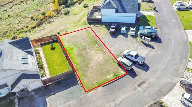 an aerial view of a house with a swimming pool