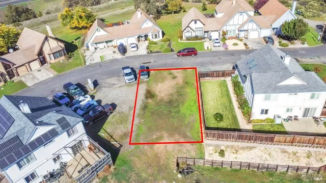 an aerial view of a house with a swimming pool