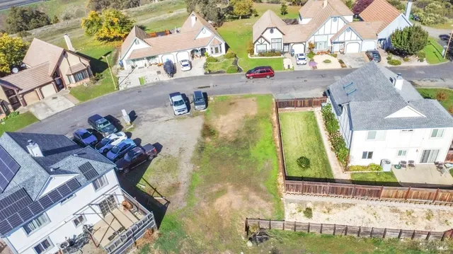 an aerial view of a pool patio kitchen and outdoor seating