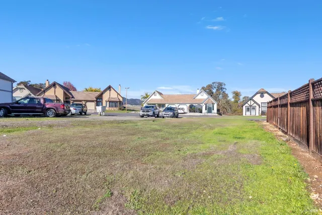 a view of a backyard with exposed pipes