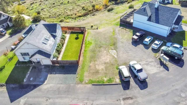 an aerial view of a house with a swimming pool