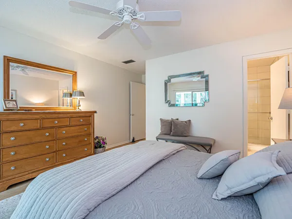 a bedroom with two beds and a window