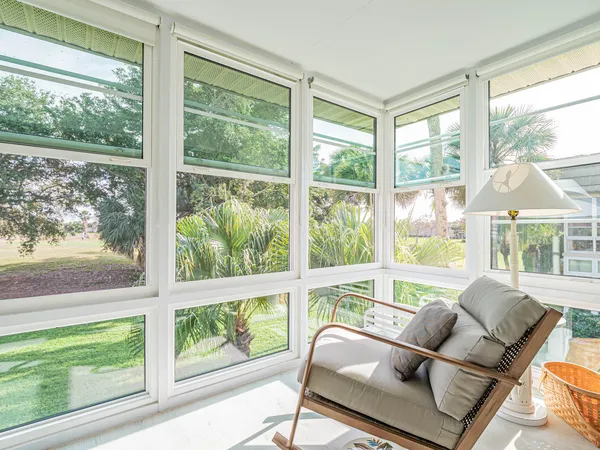 a living room with large windows