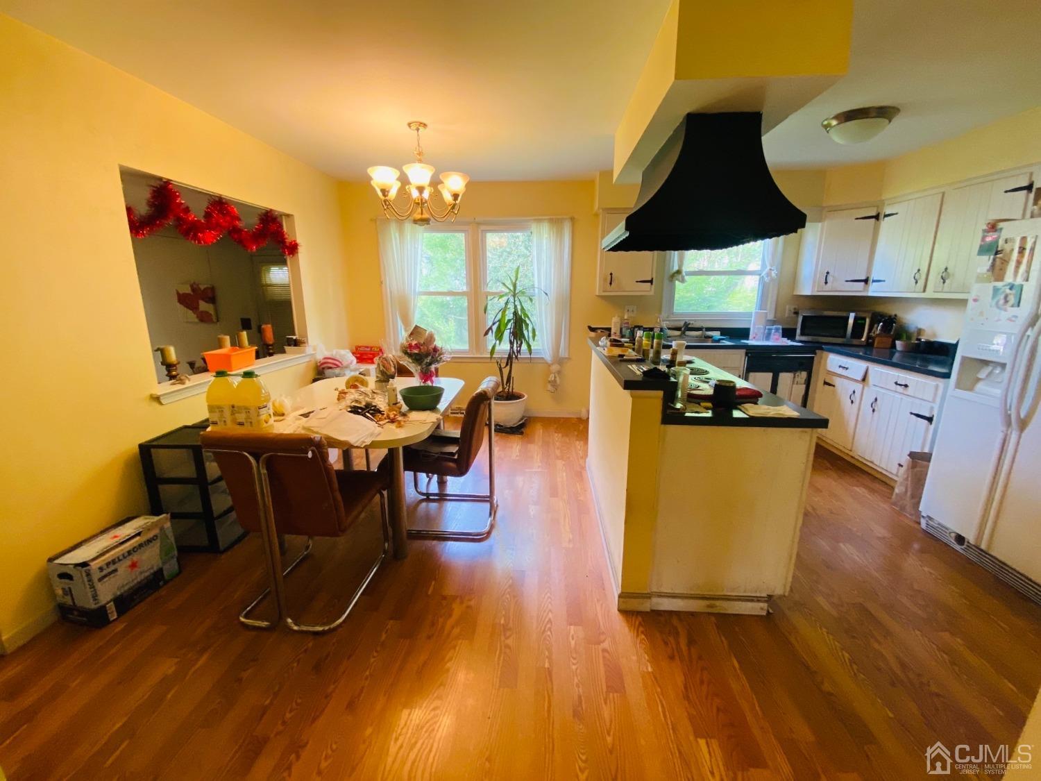 115 Sandringham Road Cherry Hill, NJ 08003 - Photo 2 of 6 a living room with furniture and a flat screen tv