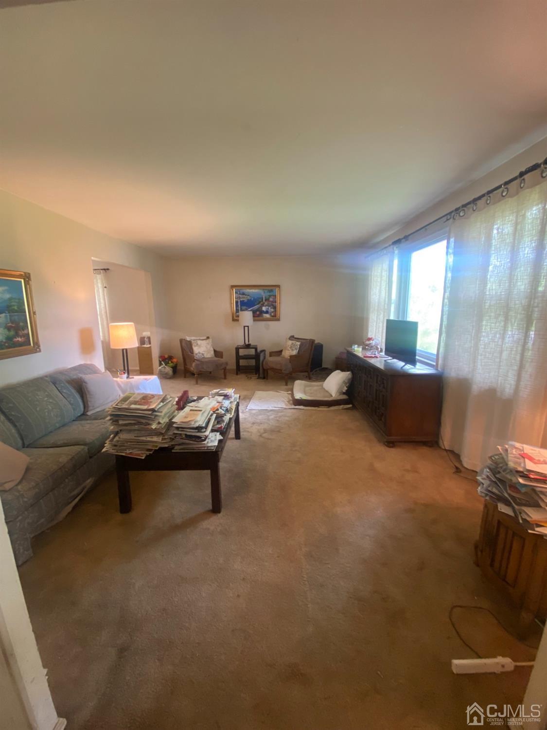 115 Sandringham Road Cherry Hill, NJ 08003 - Photo 3 of 6 a living room with furniture and a window