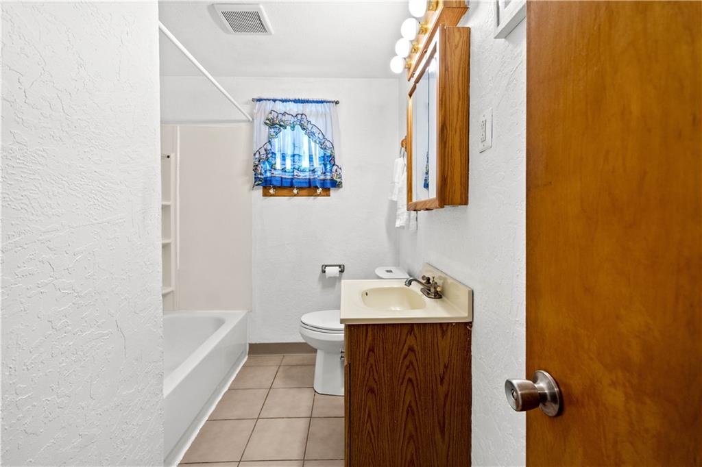3406 McRoberts Road Pittsburgh, PA 15234 - Photo 11 of 19 a bathroom with a sink and a bathtub
