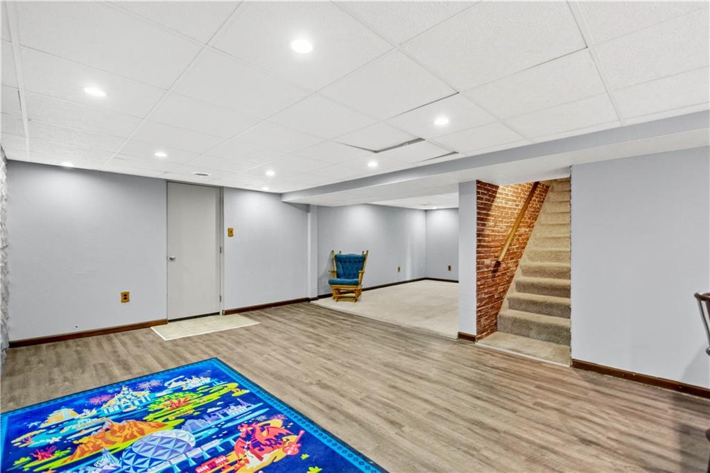 3406 McRoberts Road Pittsburgh, PA 15234 - Photo 14 of 19 a view of an empty room with stairs and toys