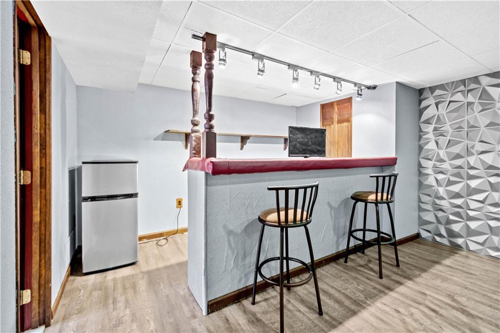 3406 McRoberts Road Pittsburgh, PA 15234 - Photo 15 of 19 a view of a kitchen with furniture and wooden floor