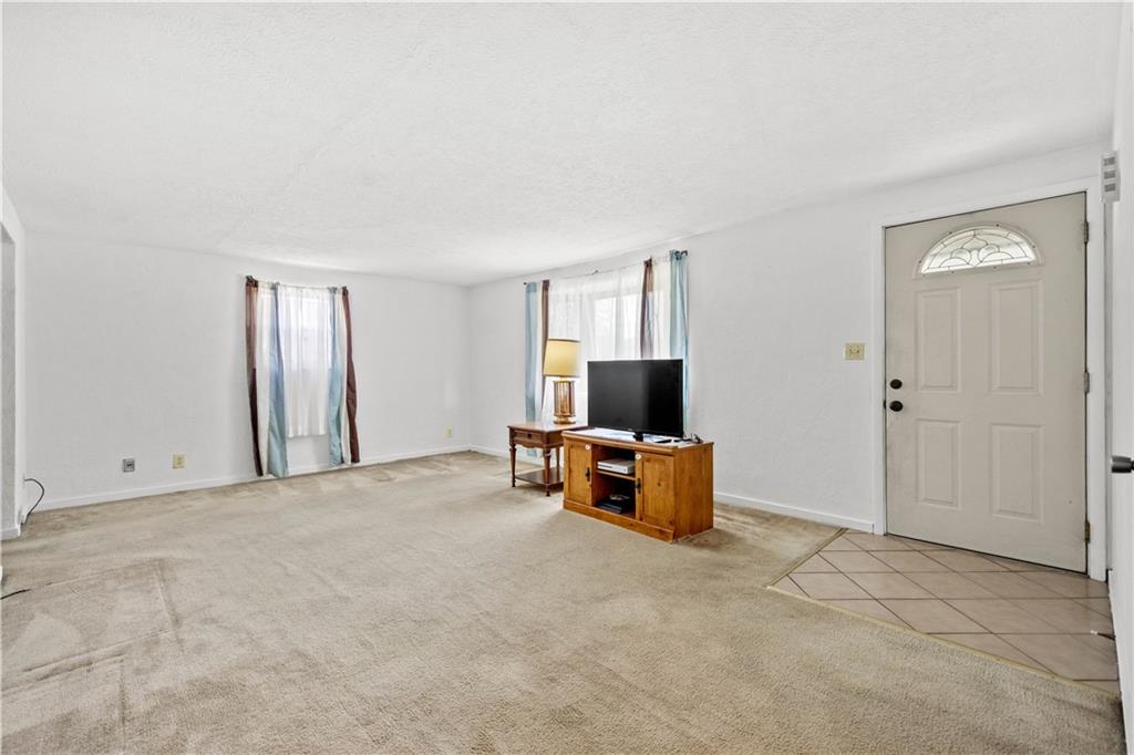 3406 McRoberts Road Pittsburgh, PA 15234 - Photo 3 of 19 a view of a livingroom with furniture and a flat screen tv